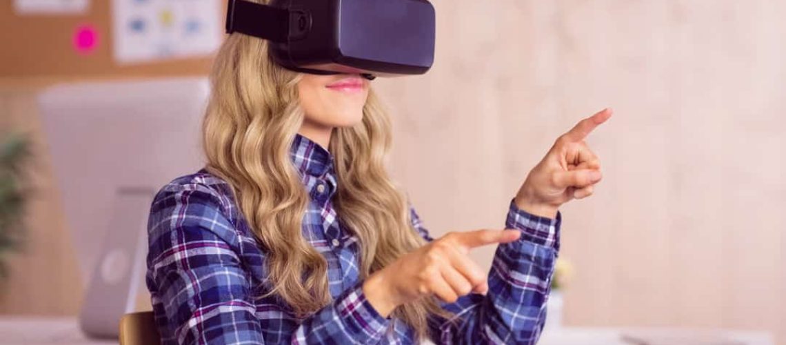 Pretty casual worker using oculus rift in her office Pretty casual worker using oculus rift in her office